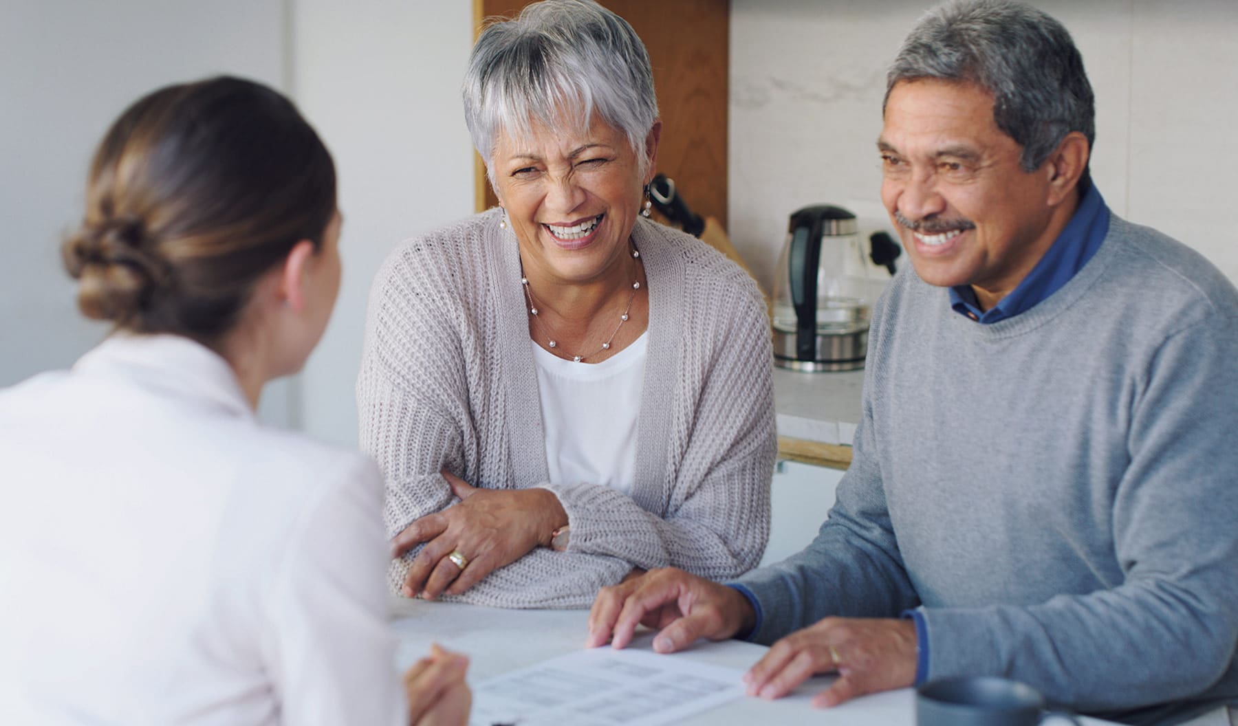 Senoir couple speaking with a Merion consultant about moving