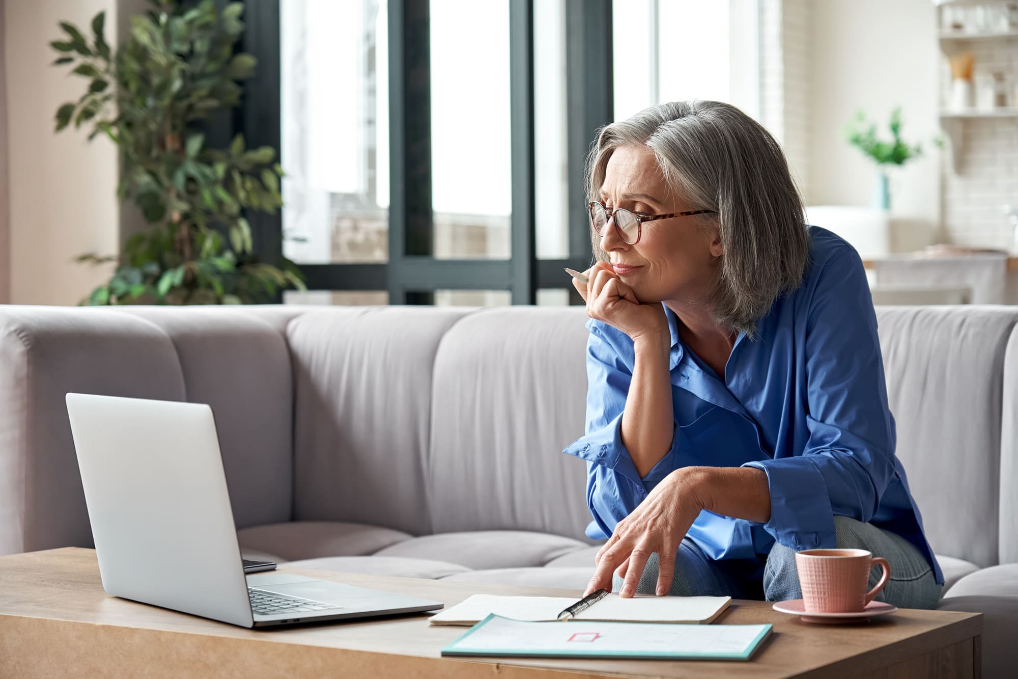 woman looking at senior living options online