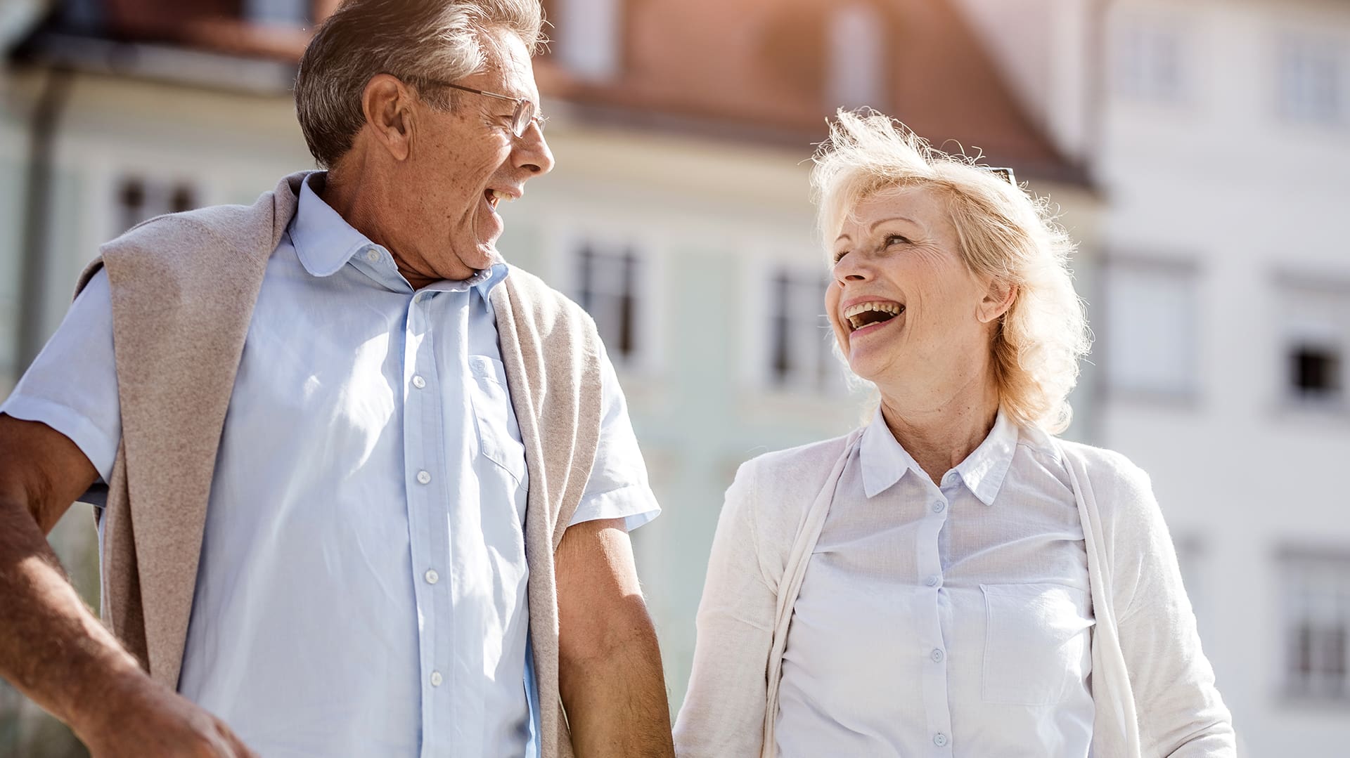 Senior Couple Walking Around Old Town