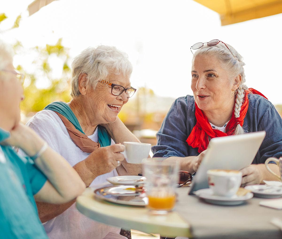 Women enjoying coffee together.