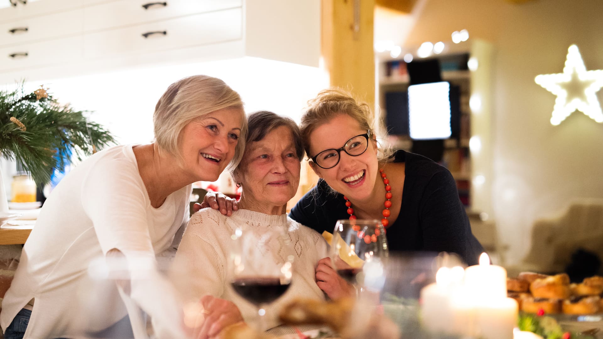 Mother, grandmother and daughter celebrating Christmas