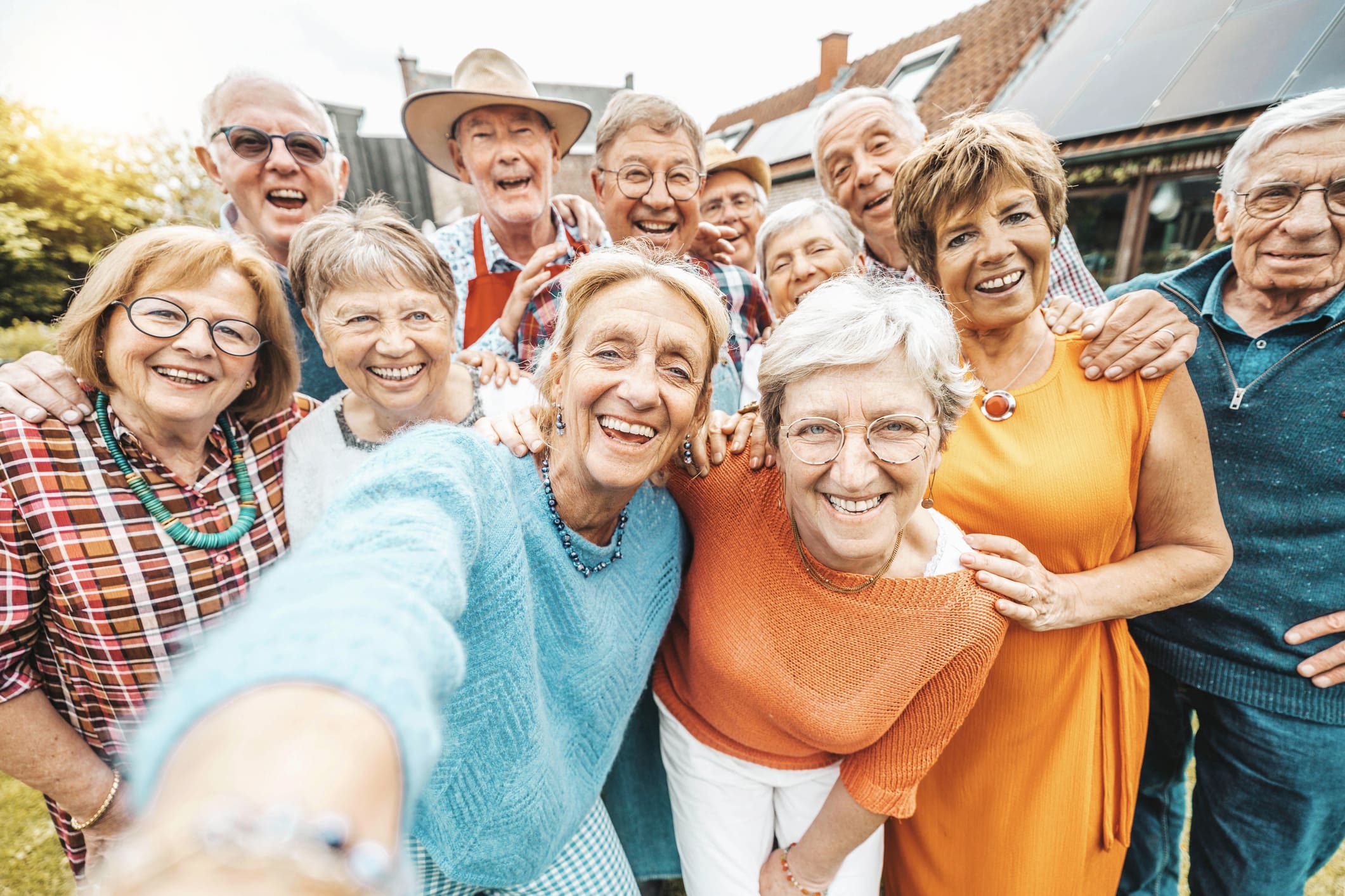 Happy group of senior people smiling at camera outdoors