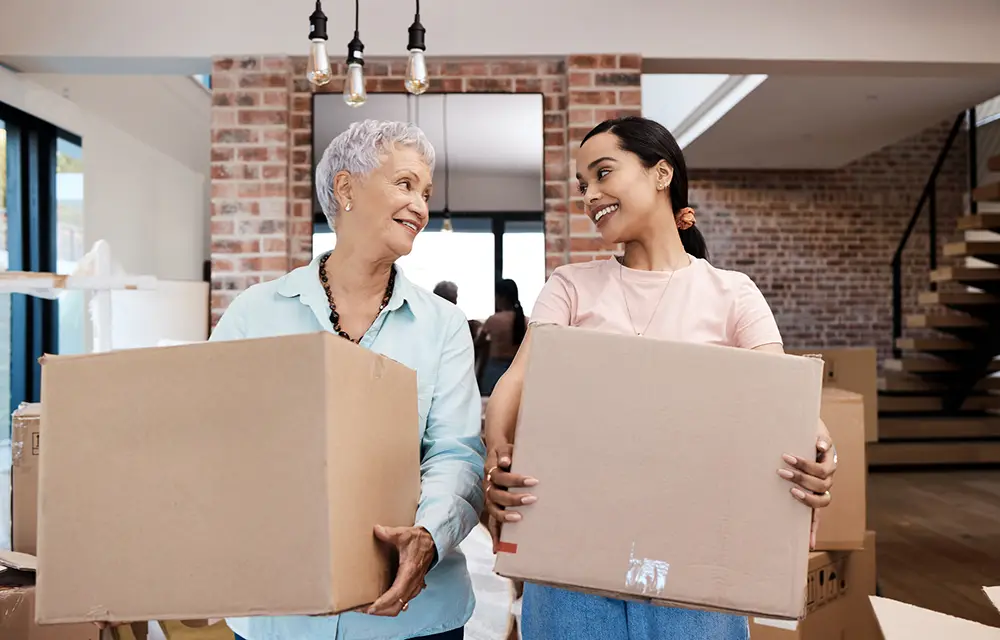 Shot of a senior woman moving house with help from her daughter